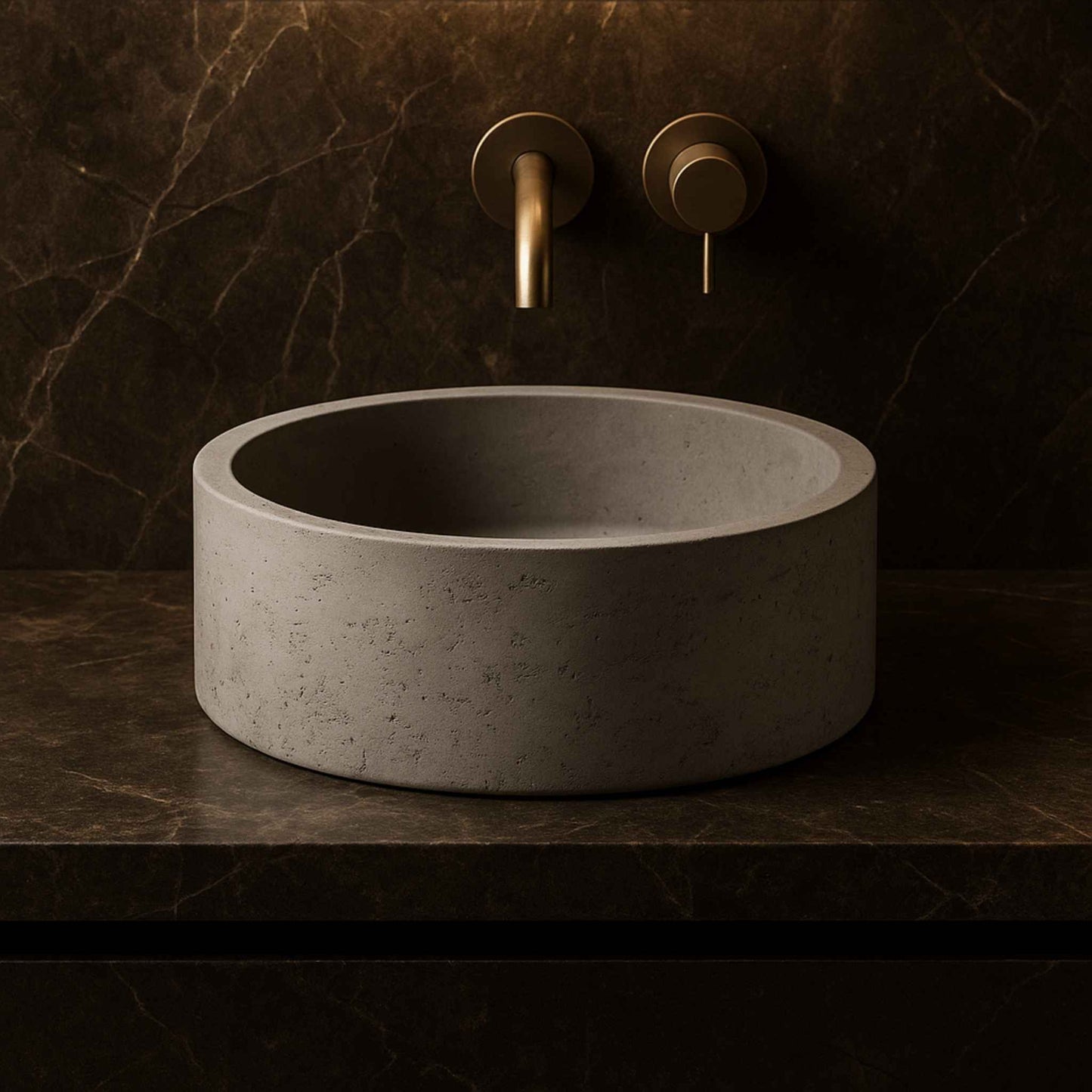 Front view of raw textured concrete round wash basin placed in a luxury bathroom