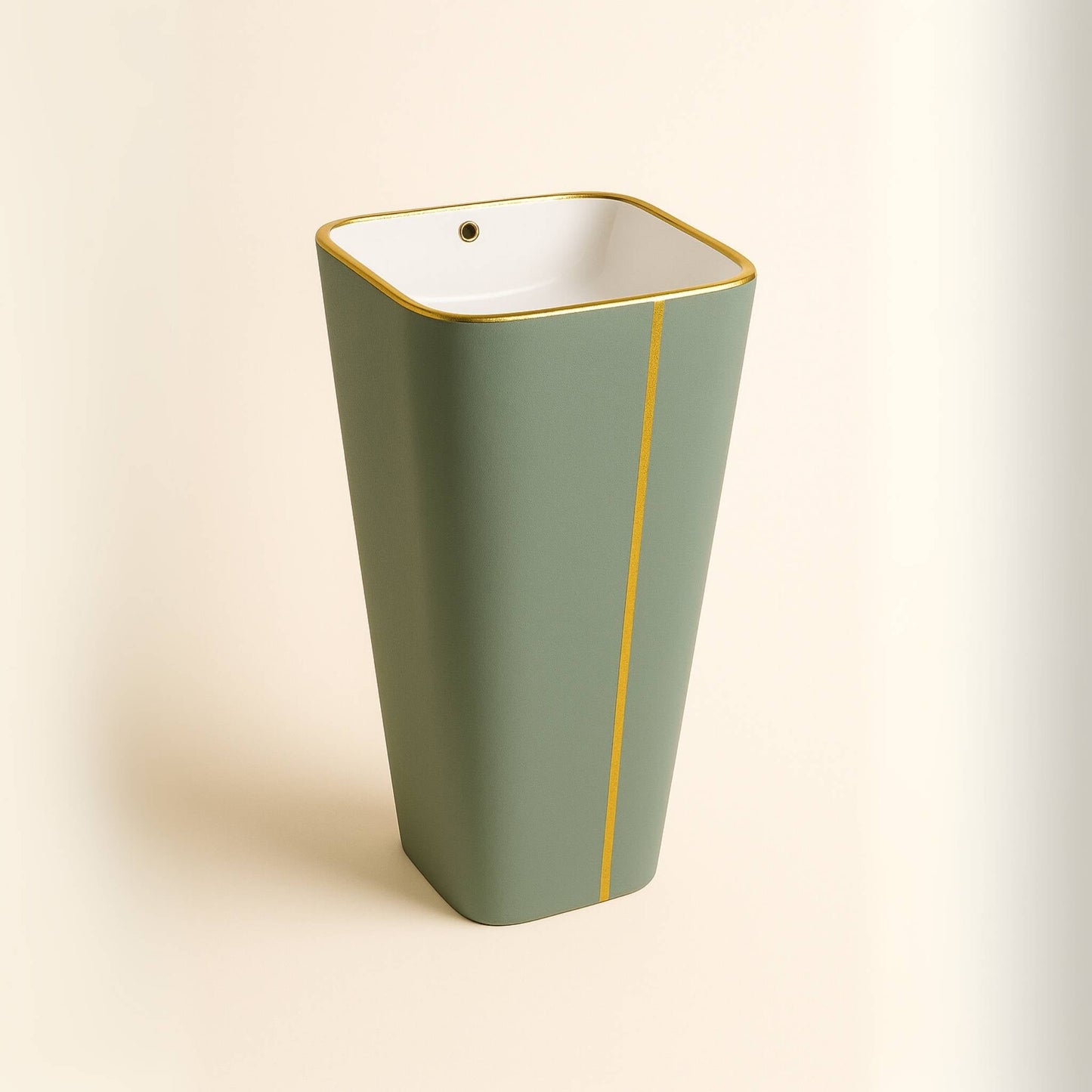 Front view of sage green pedestal washbasin with gold accent from Regalia Collection