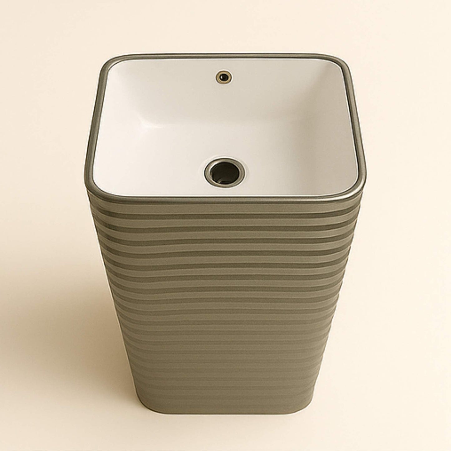 Top view of square white ceramic bowl in glossy silver pedestal basin