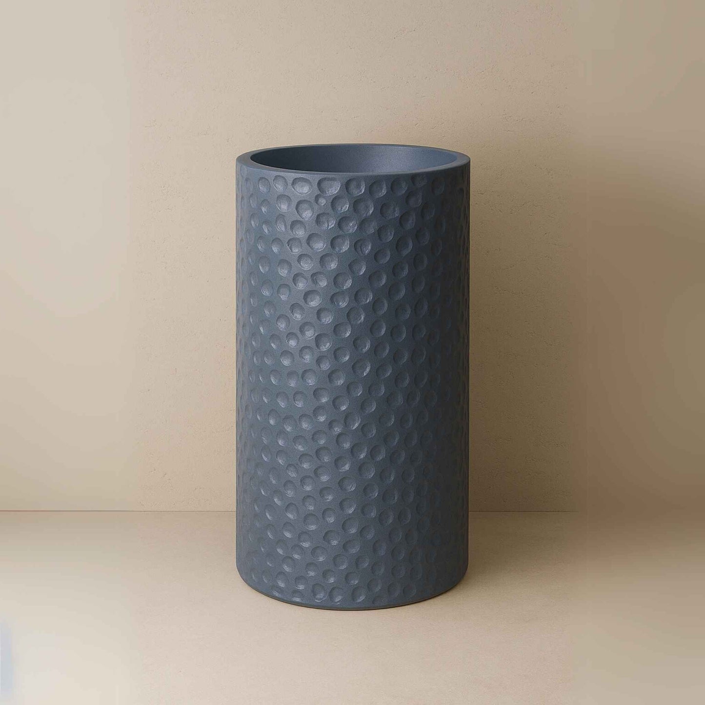 Front view of textured slate blue pedestal basin with hammered finish