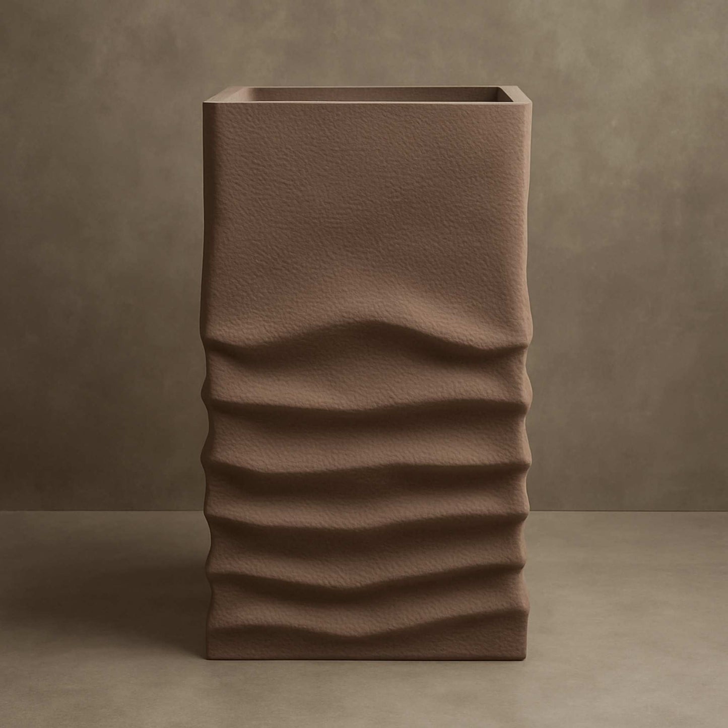 Front view of taupe pedestal basin with organic wave texture