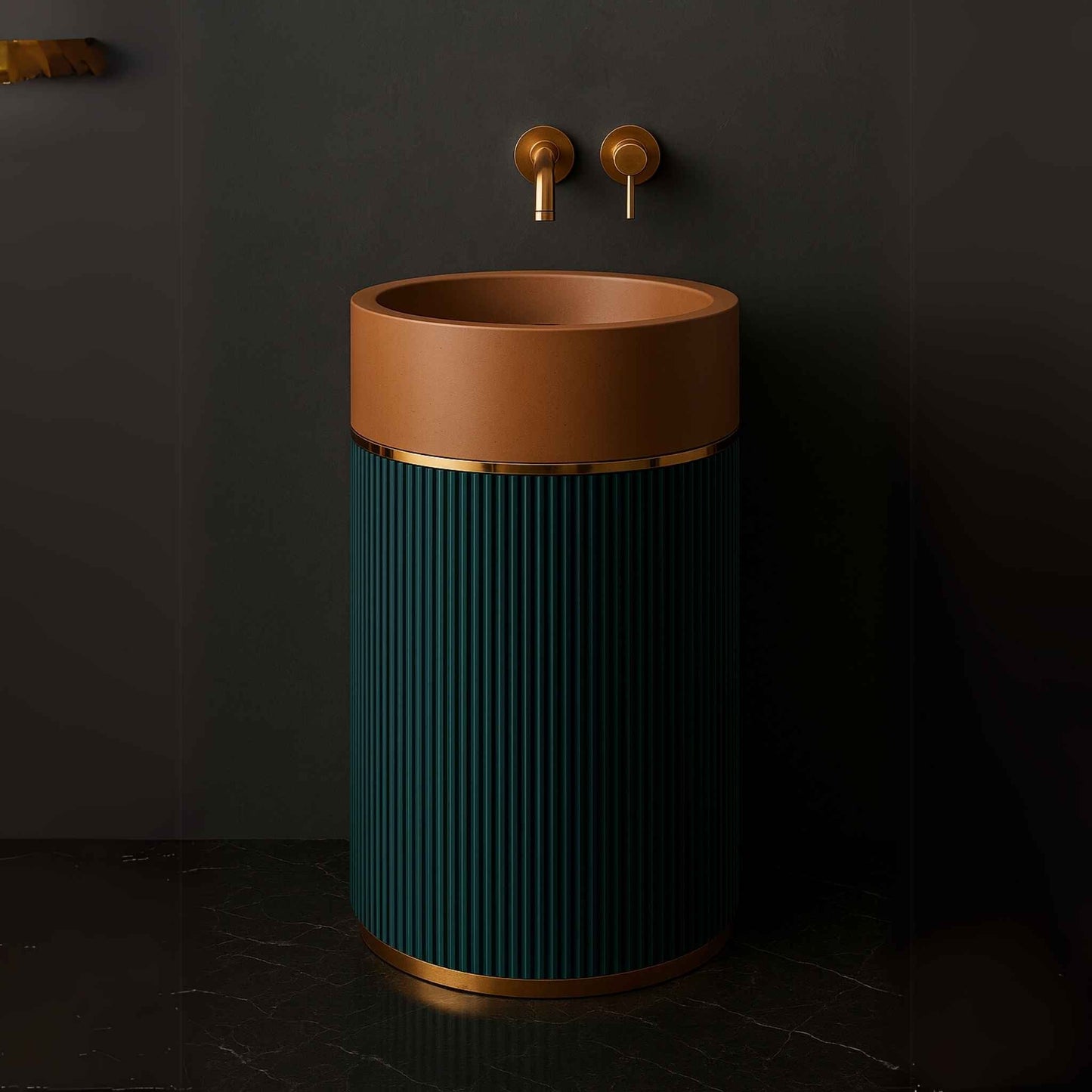 Cylindrical pedestal washbasin with terracotta top, teal fluted base, and brass wall-mounted faucet in luxury bathroom side angle