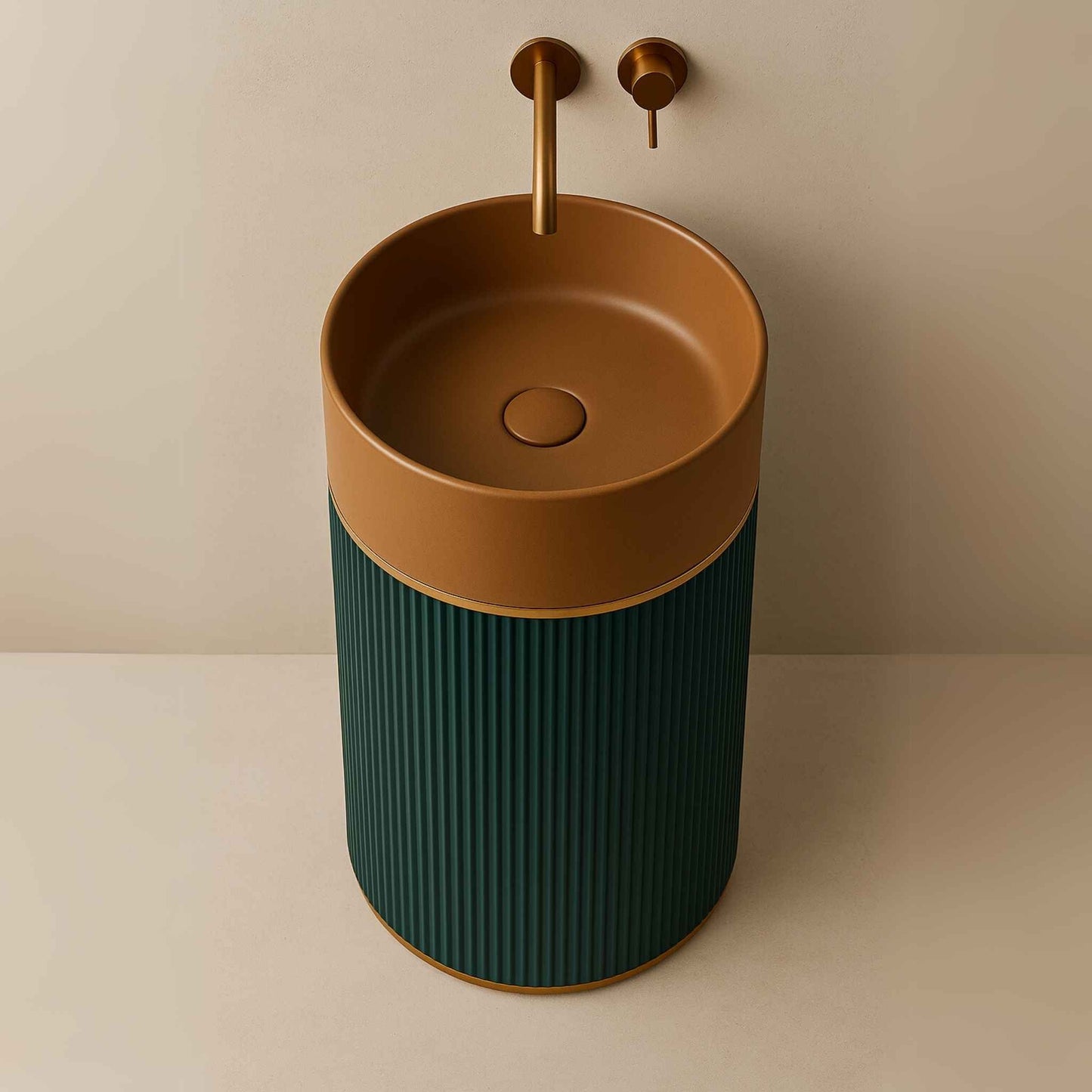 Cylindrical pedestal washbasin with terracotta top, teal fluted base, and brass wall-mounted faucet in luxury bathroom top angle