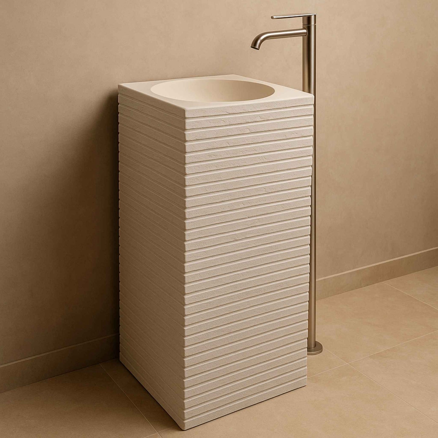 Side angle of off-white rectangular basin with brushed steel faucet