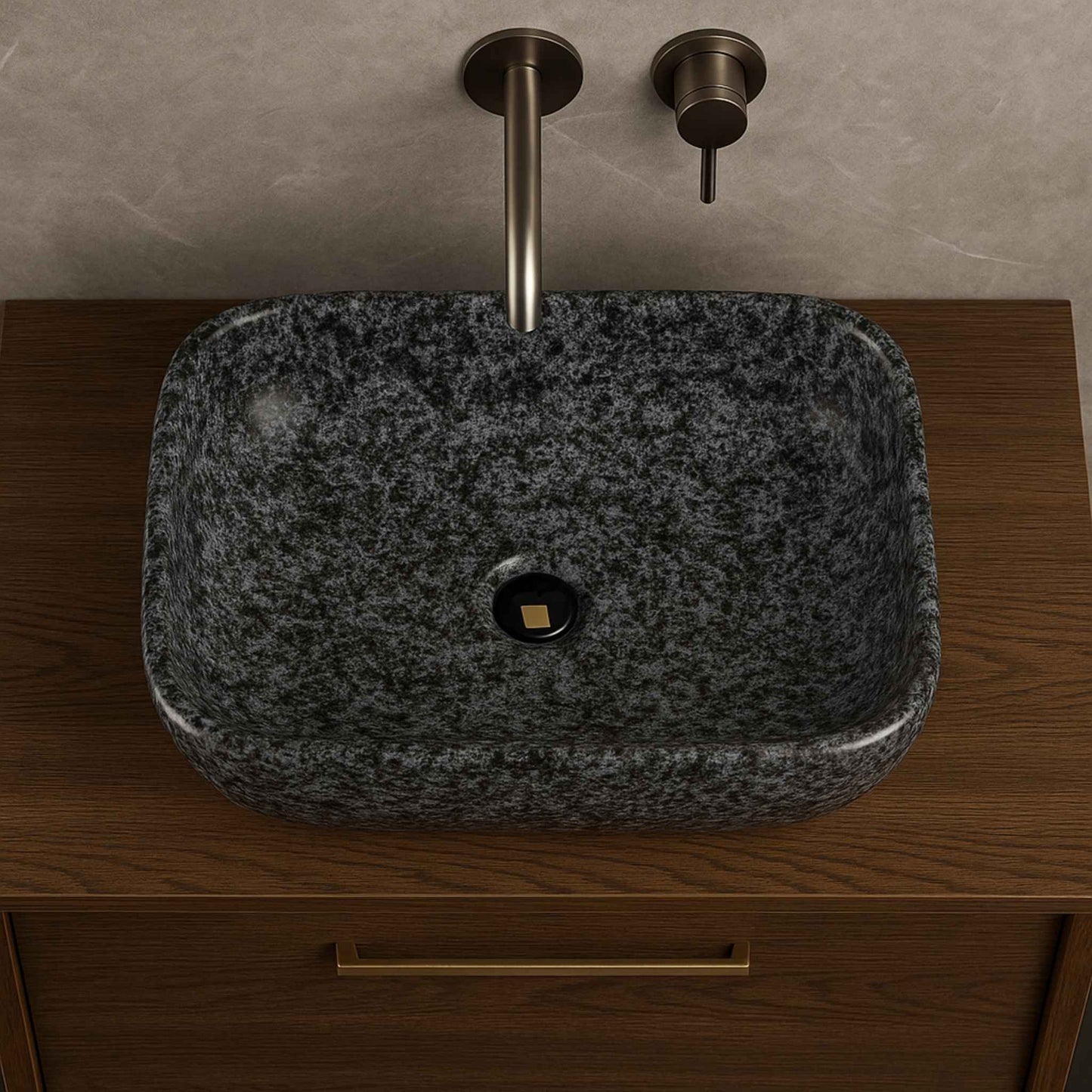 Top angle of glossy black granite bathroom countertop wash basin