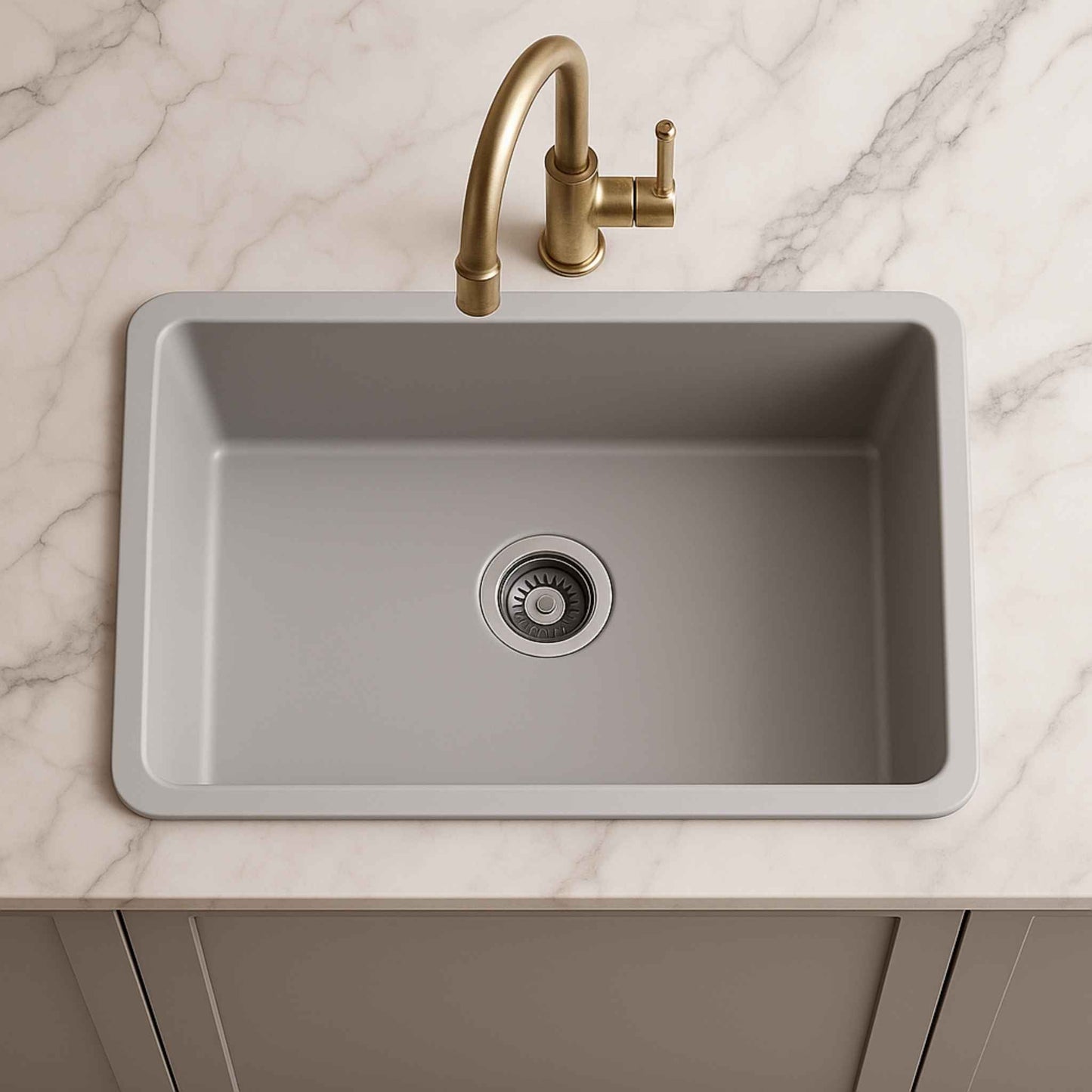 Top-down shot of grey granite sink in marble kitchen