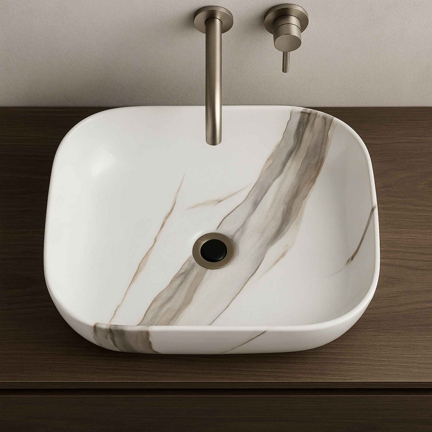 Top angle of rectangular white marble basin with bold natural veins in luxury bathroom setting
