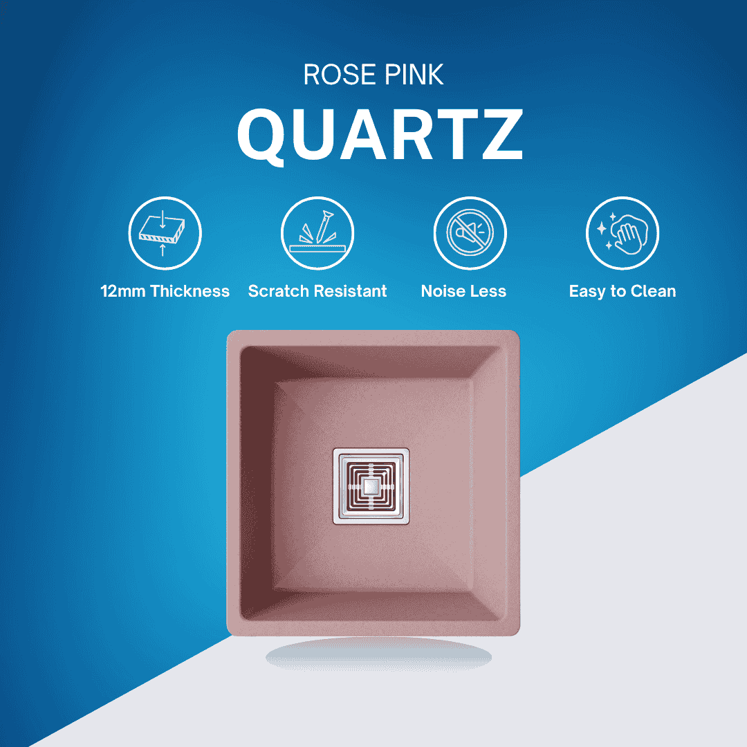 Top-down view of rose pink granite sink showing designer square stainless steel drain