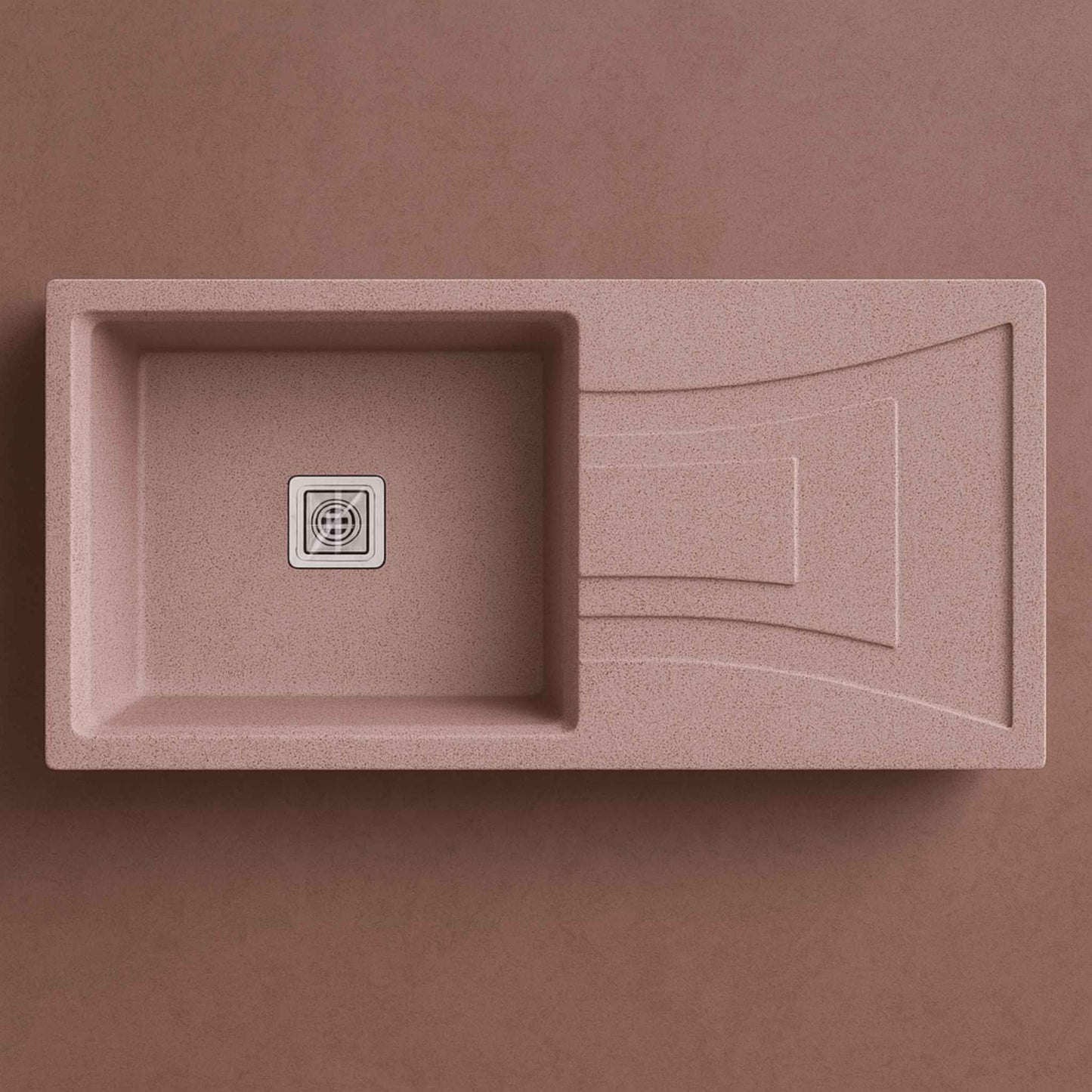 Top view of single bowl rose quartz sink with drainboard and square coupling