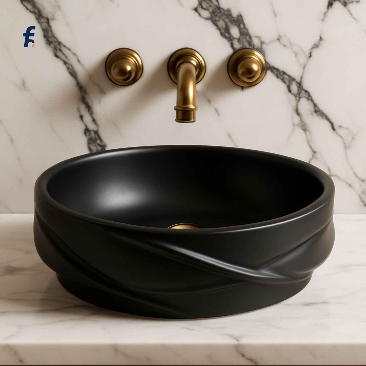 Top-down view of round matte black bathroom basin with gold faucet