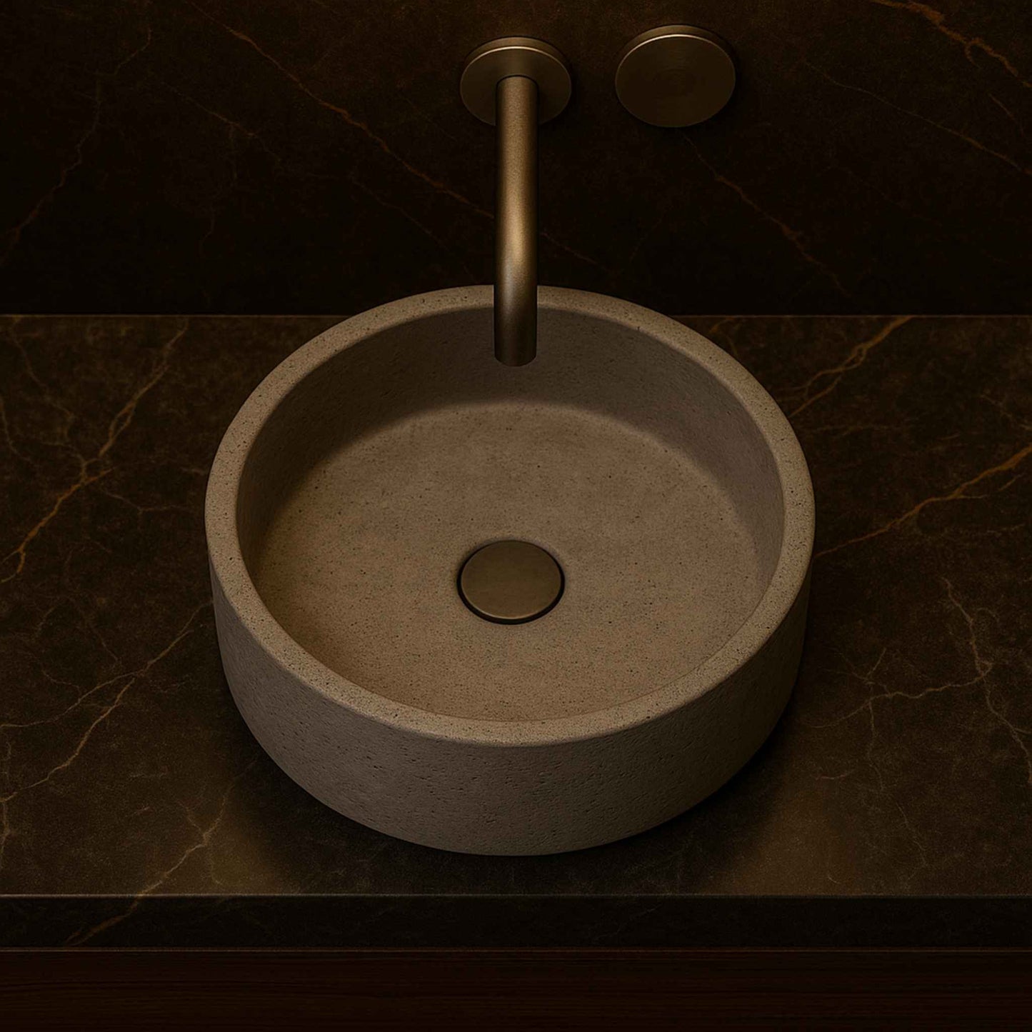 Top angle image of minimalist round grey concrete basin with wall-mounted faucet