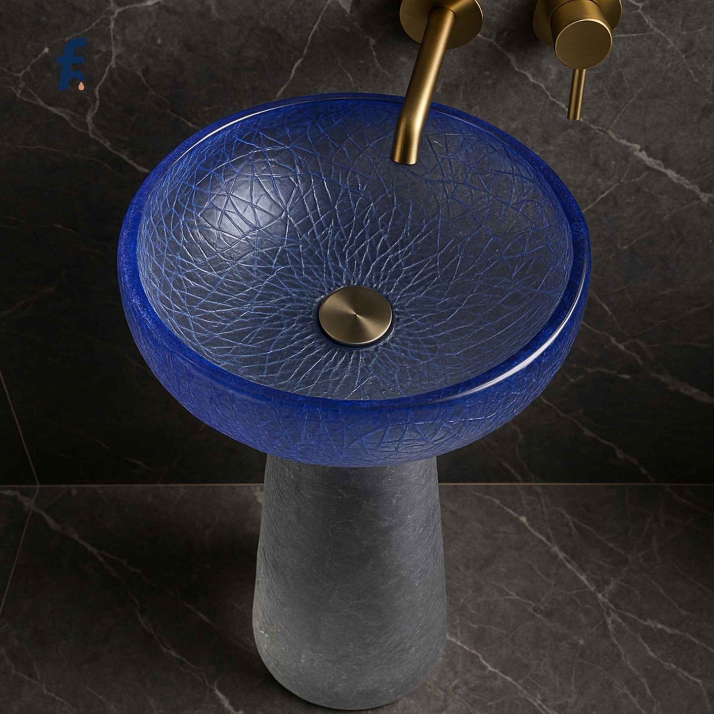 Zoomed top-side angle of textured blue glass washbasin and gold faucet