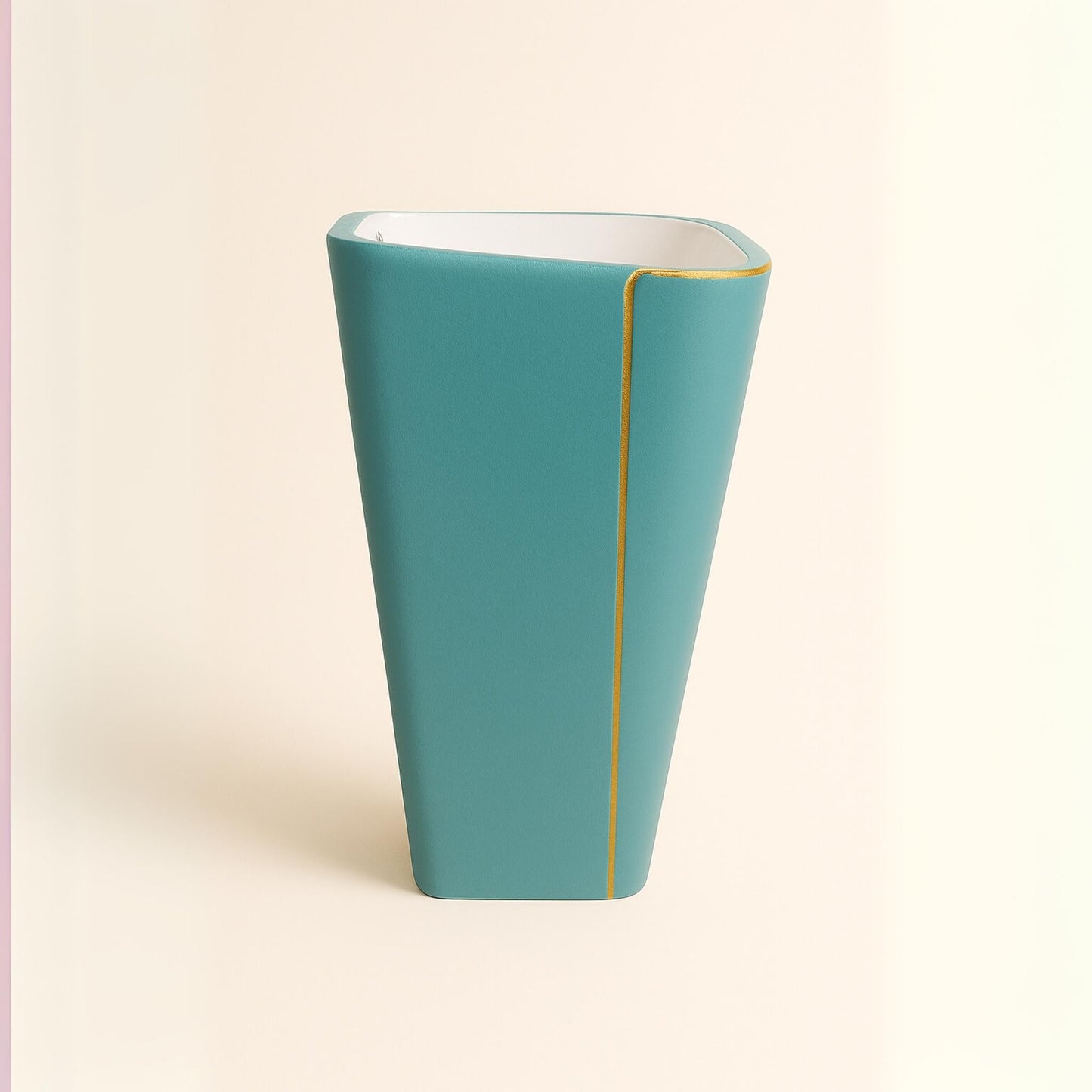 Side profile of designer turquoise freestanding washbasin with golden stripe