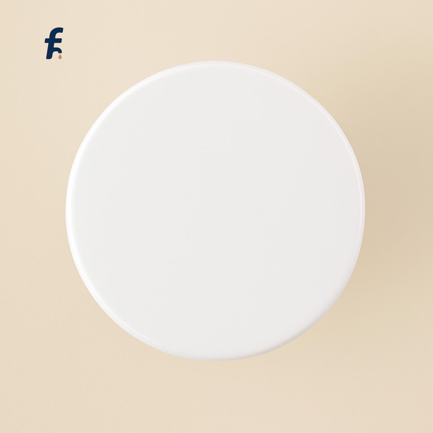Top-down view of white glossy pop-up drain stopper