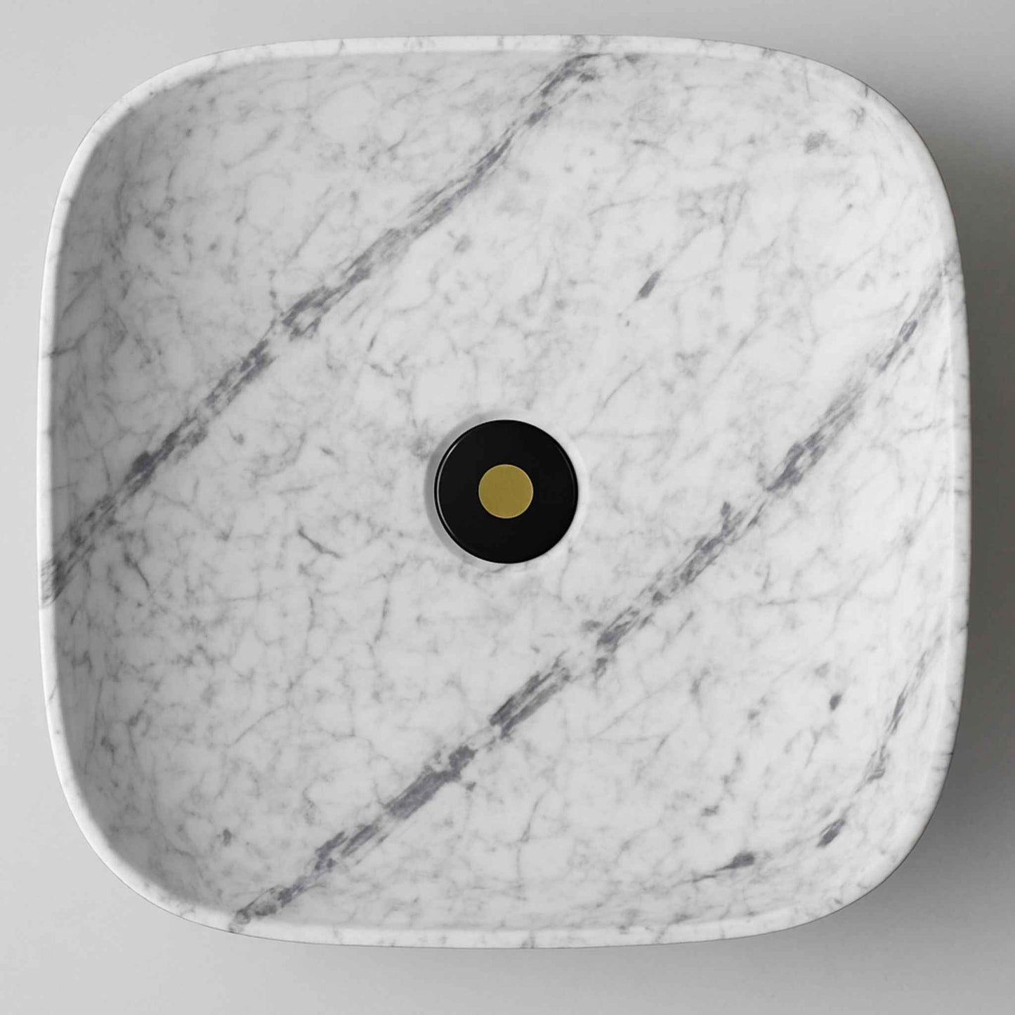 Top angle of rectangular marble wash basin with natural grey veining
