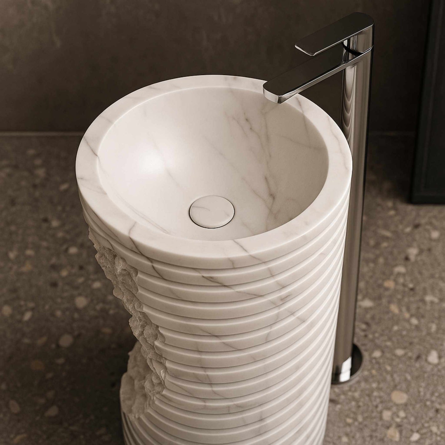 Top view of round marble wash basin with natural veins and chrome tap