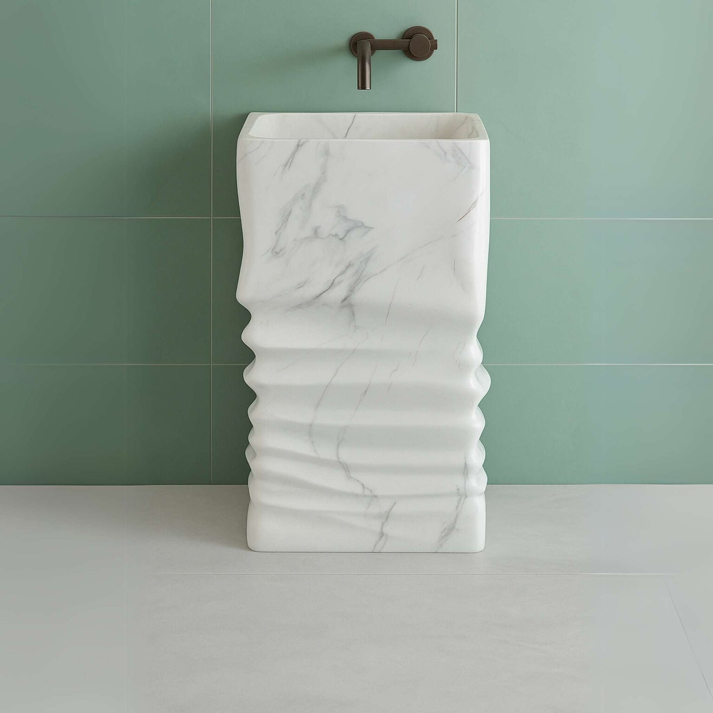 Front view of white marble pedestal sink with wave texture and grey veins