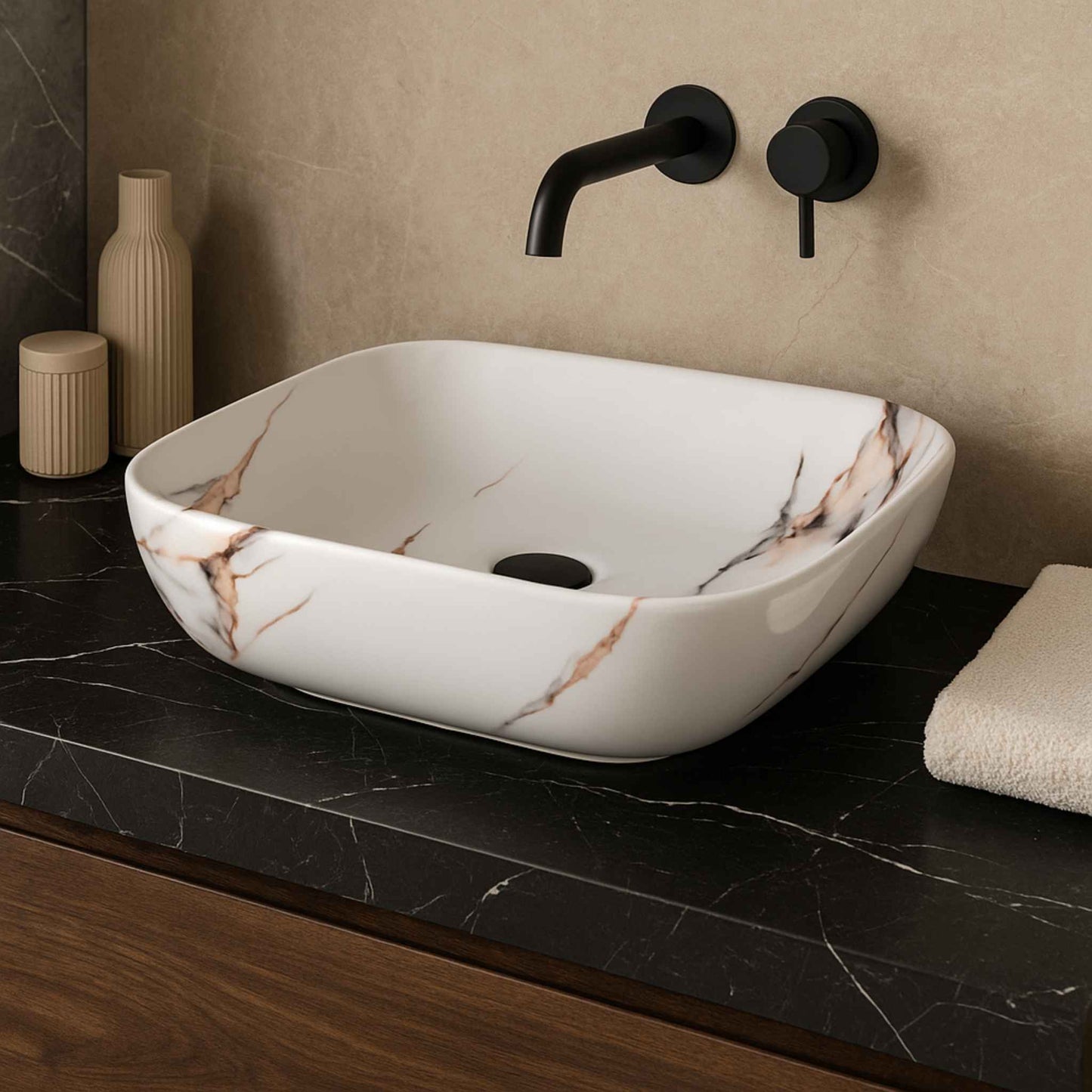 Front view of rectangular white marble wash basin with copper and grey veining on black stone vanity