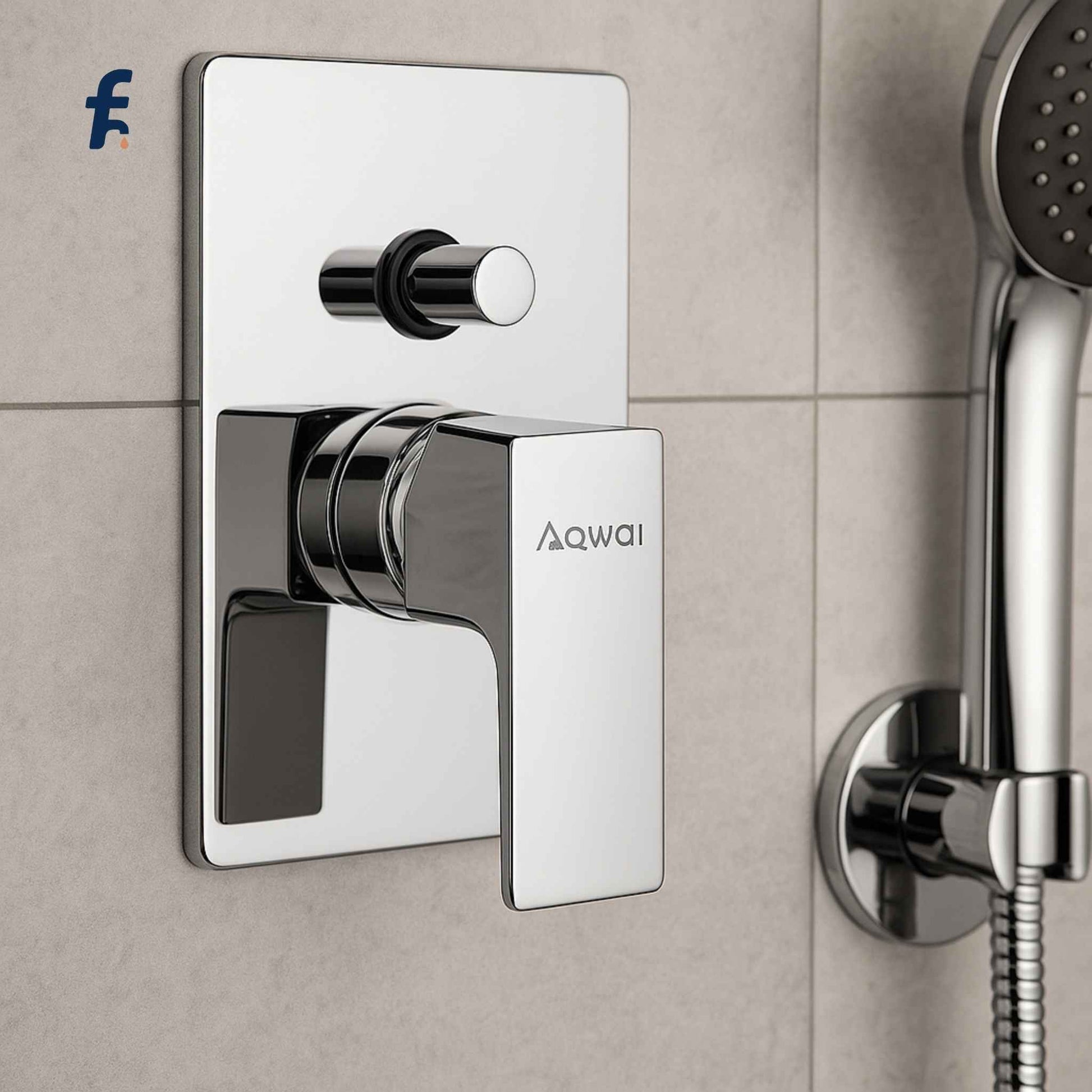 Chrome shower valve and handheld shower head on a tiled wall with Aqwai branding. Aqwai concealed diverter installed with modern shower setup