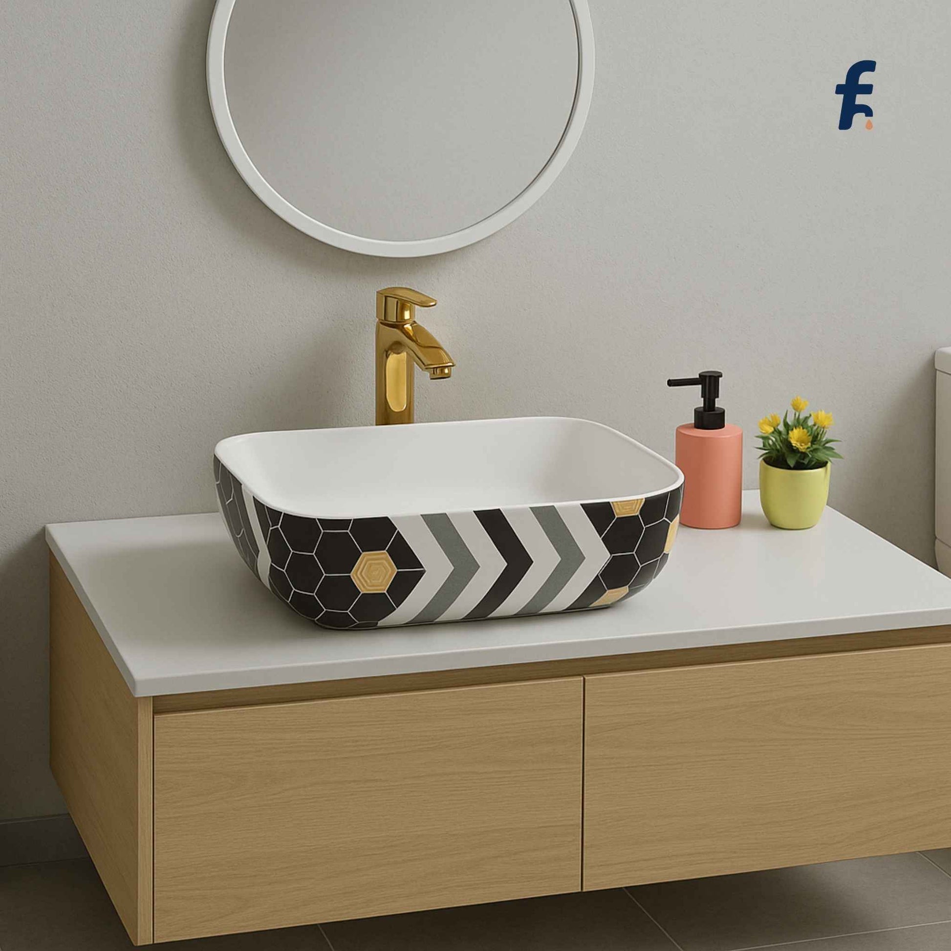 Bathroom vanity with a patterned sink, gold faucet, and decorative items. , 