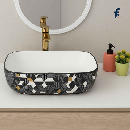 Bathroom vanity with geometric-patterned sink, mirror, and small plant.