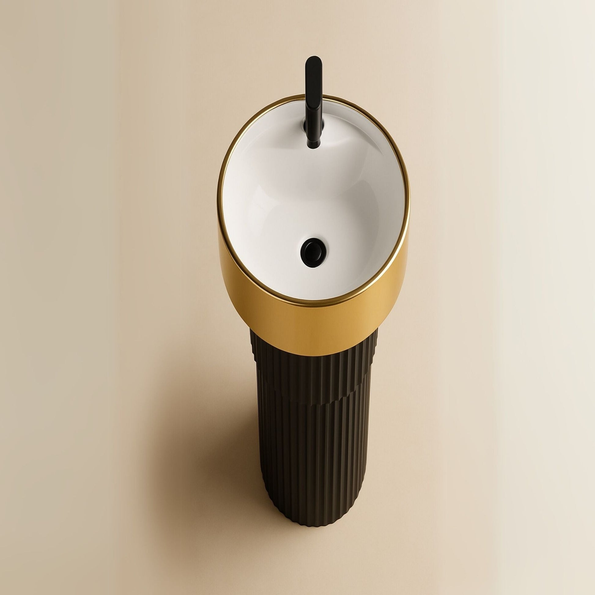 Top angle of round black and gold pedestal basin