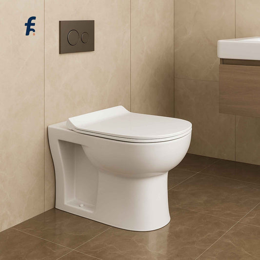 White toilet in a bathroom with beige tiles and a visible brand logo.