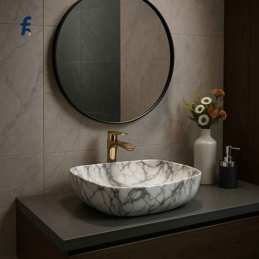 Marble-patterned sink with gold faucet in a bathroom setting, Full bathroom setup featuring affordable rectangular white marble ceramic wash basin.