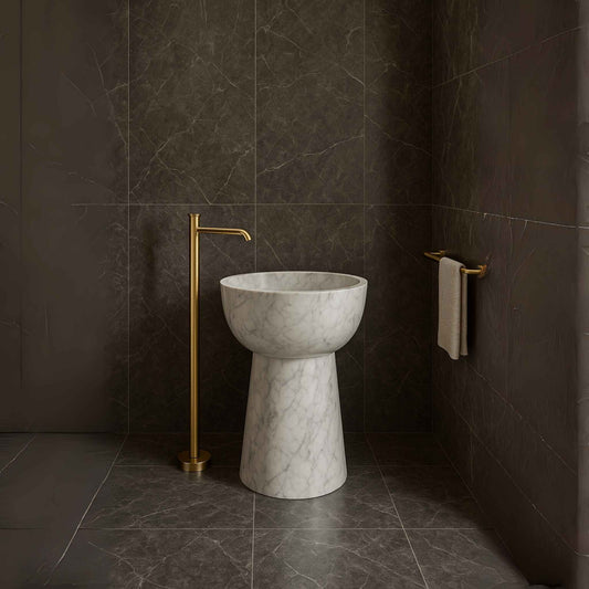 Full bathroom interior with floor-mounted brushed gold faucet and pedestal basin