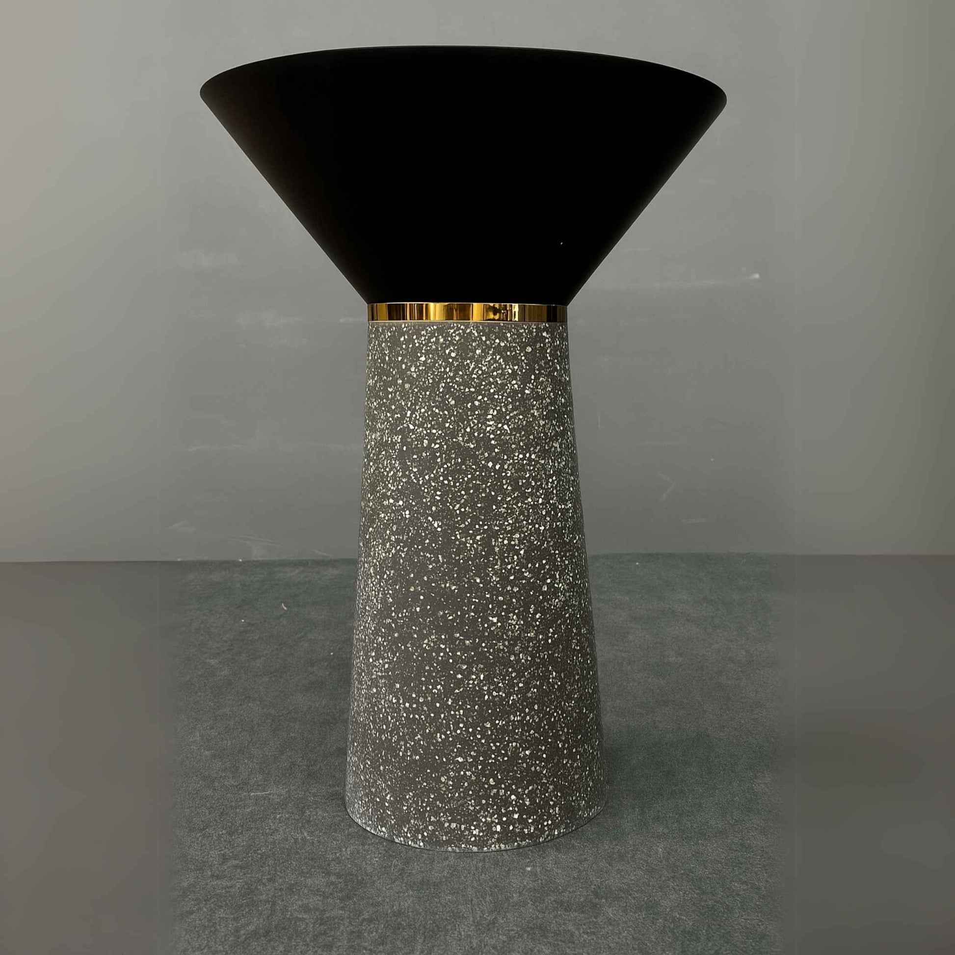 Front view of black cone pedestal basin with granite-textured base