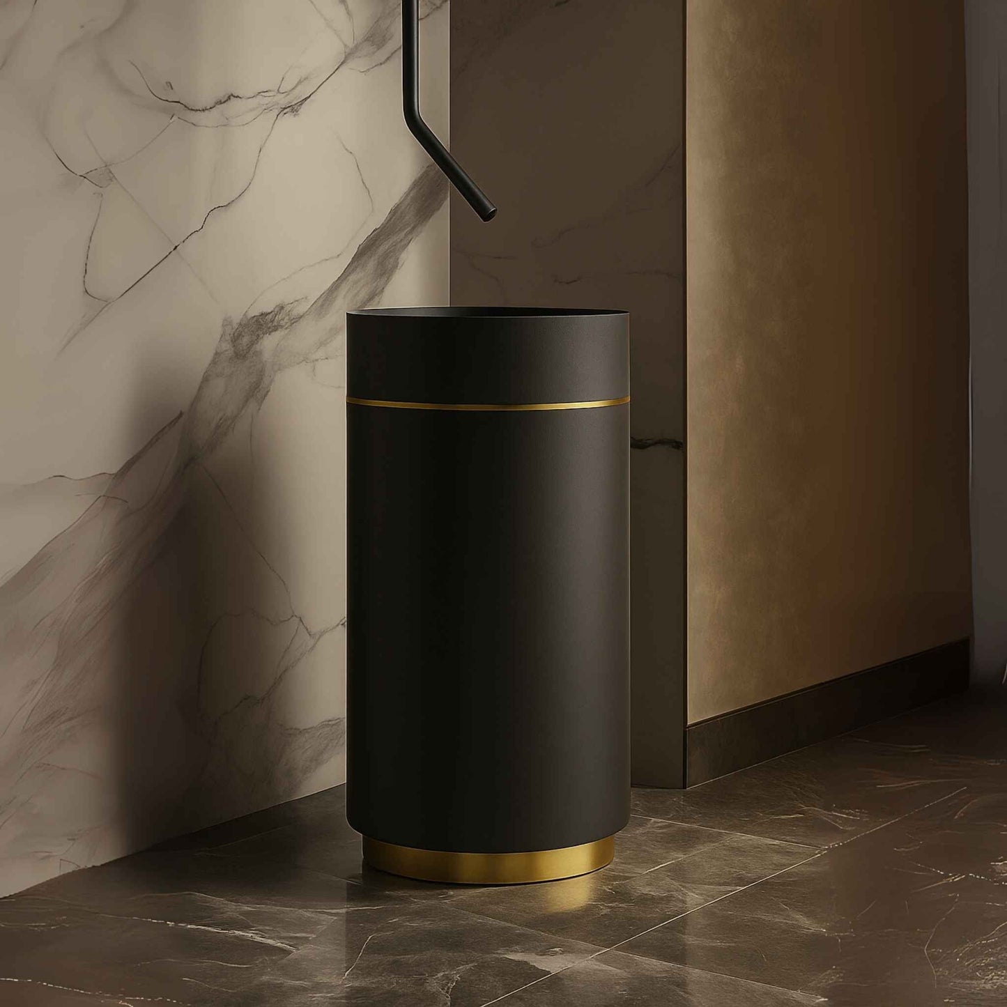 Side angled view of black and gold pedestal basin placed in a high-end bathroom with marble walls and luxury lighting