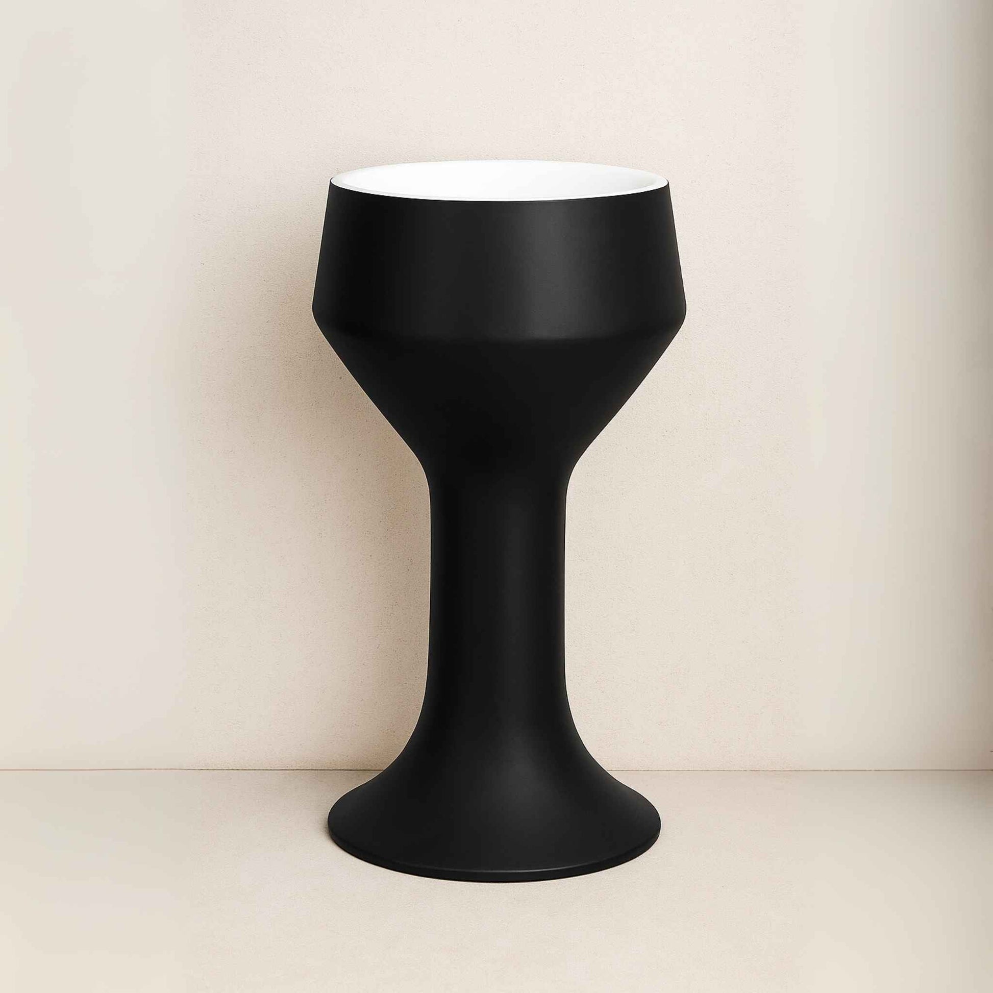 Front angle of matte black hourglass washbasin with white top