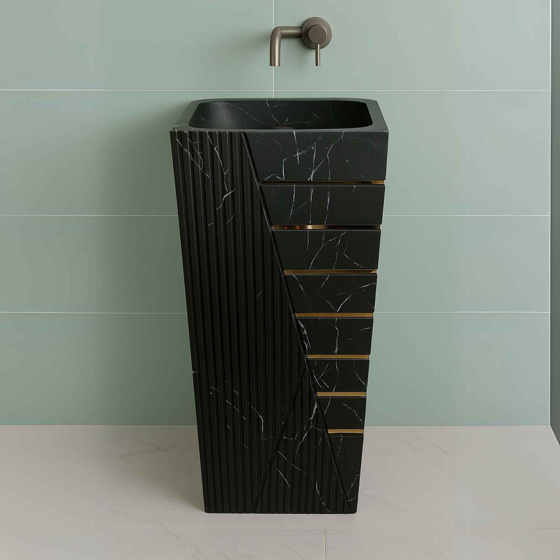 Front view of black marble pedestal sink with white veins and gold detailing