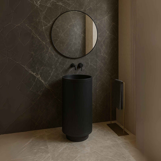 Front view of matte black fluted pedestal basin