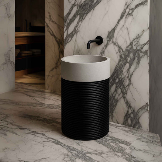 Front view of cylindrical black ribbed pedestal basin with white top
