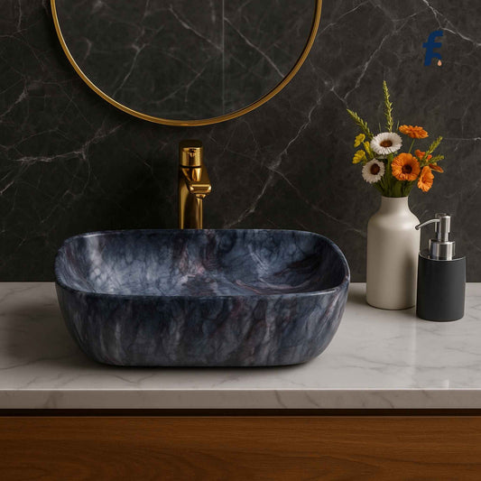 Marble sink with gold faucet, white vase with flowers, and black soap dispenser on a marble countertop, 