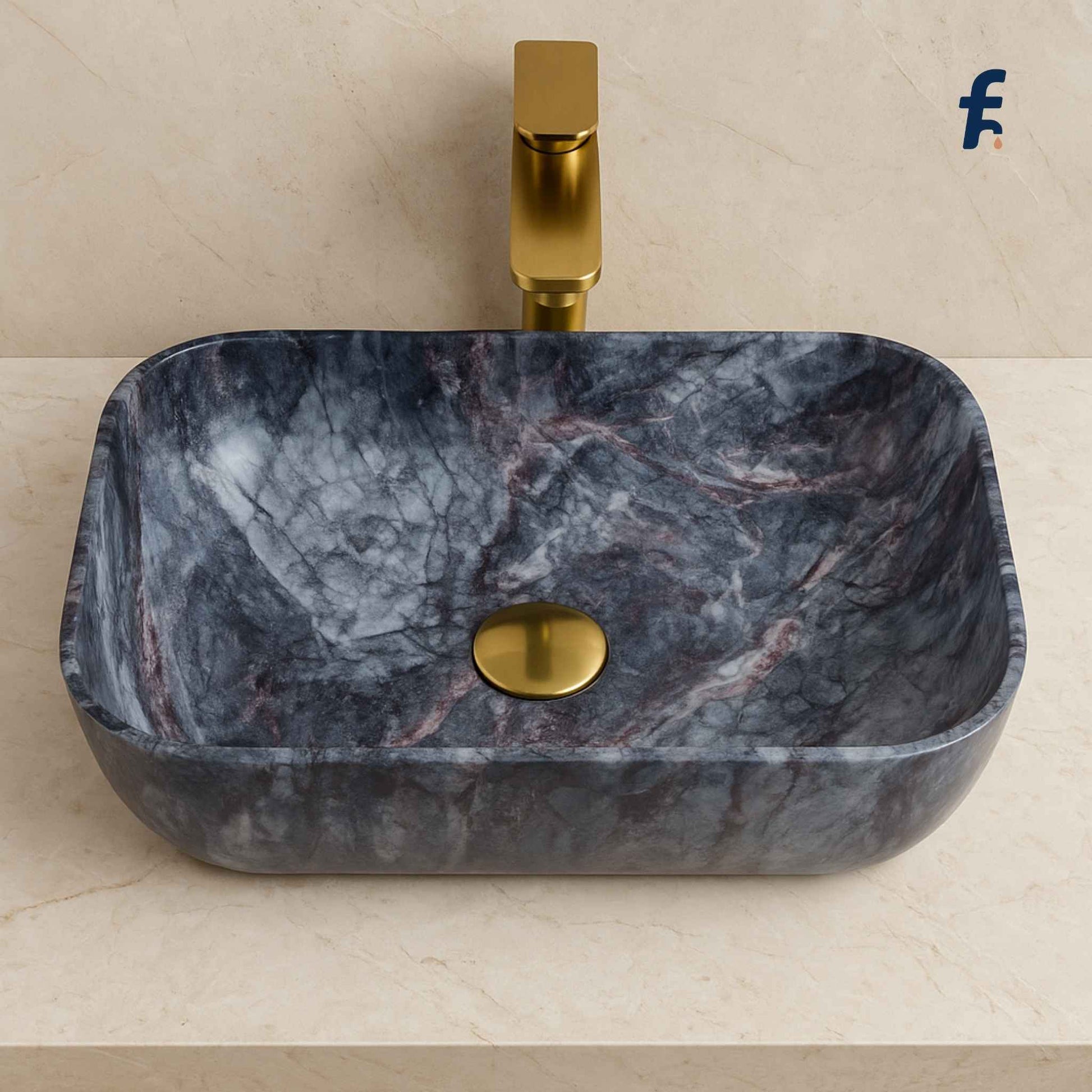 Marble-patterned sink with gold faucet on a beige background