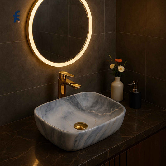 Bathroom vanity with marble sink, gold faucet, and illuminated round mirror. Front view of 18x13 ceramic wash basin with blue marble finish – Affordable Series