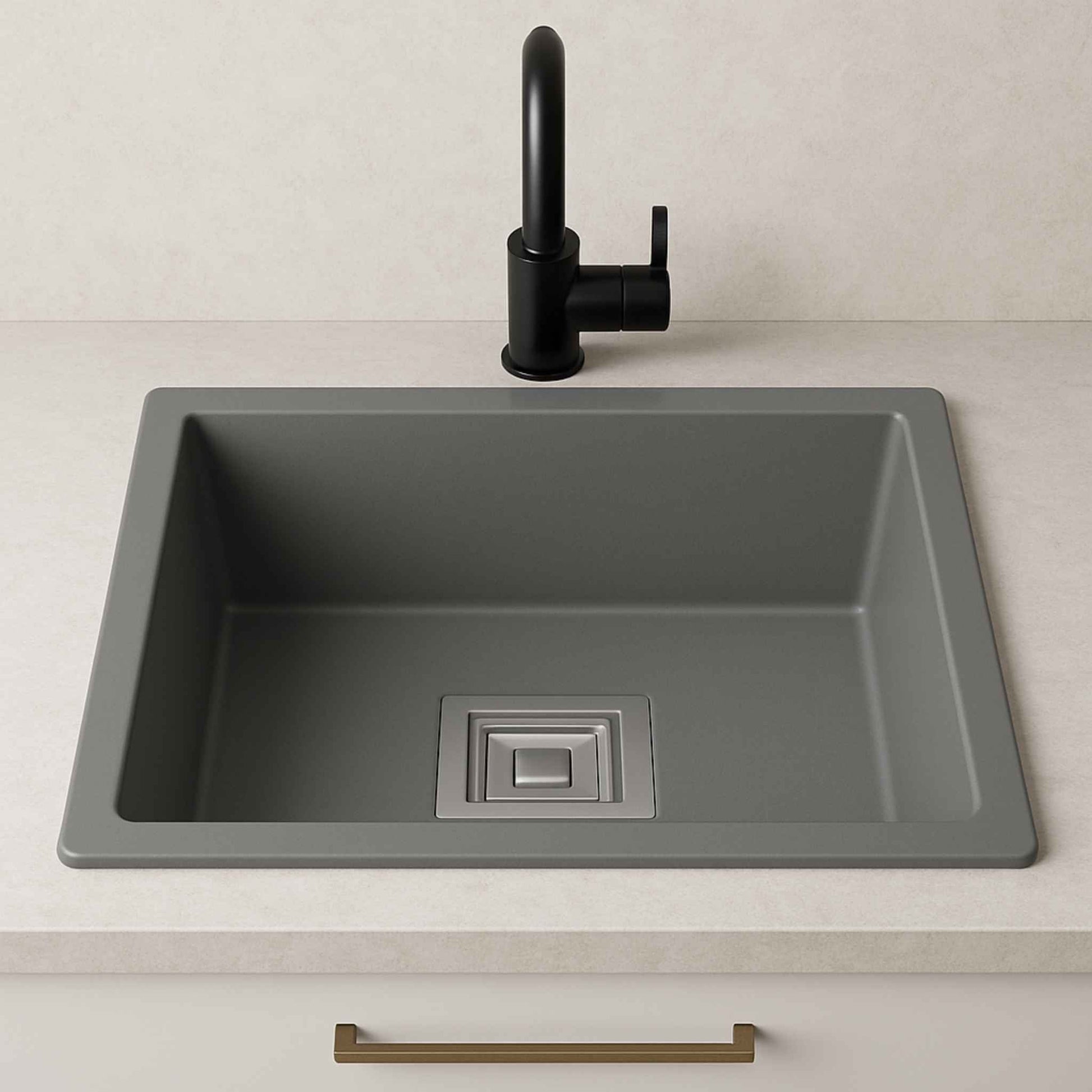 Front view of grey metallic kitchen sink with black faucet