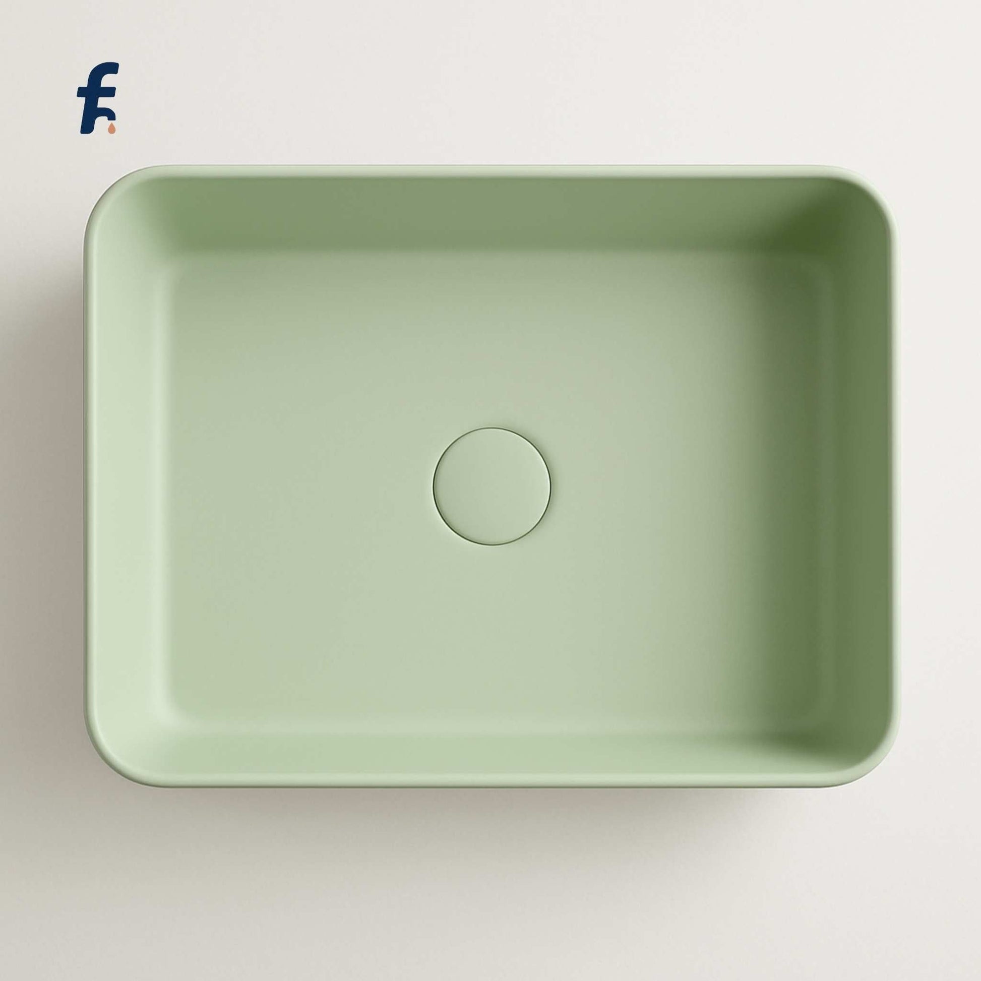 Green rectangular sink on a light grey background, Top view of mint green bathroom basin for luxury interiors