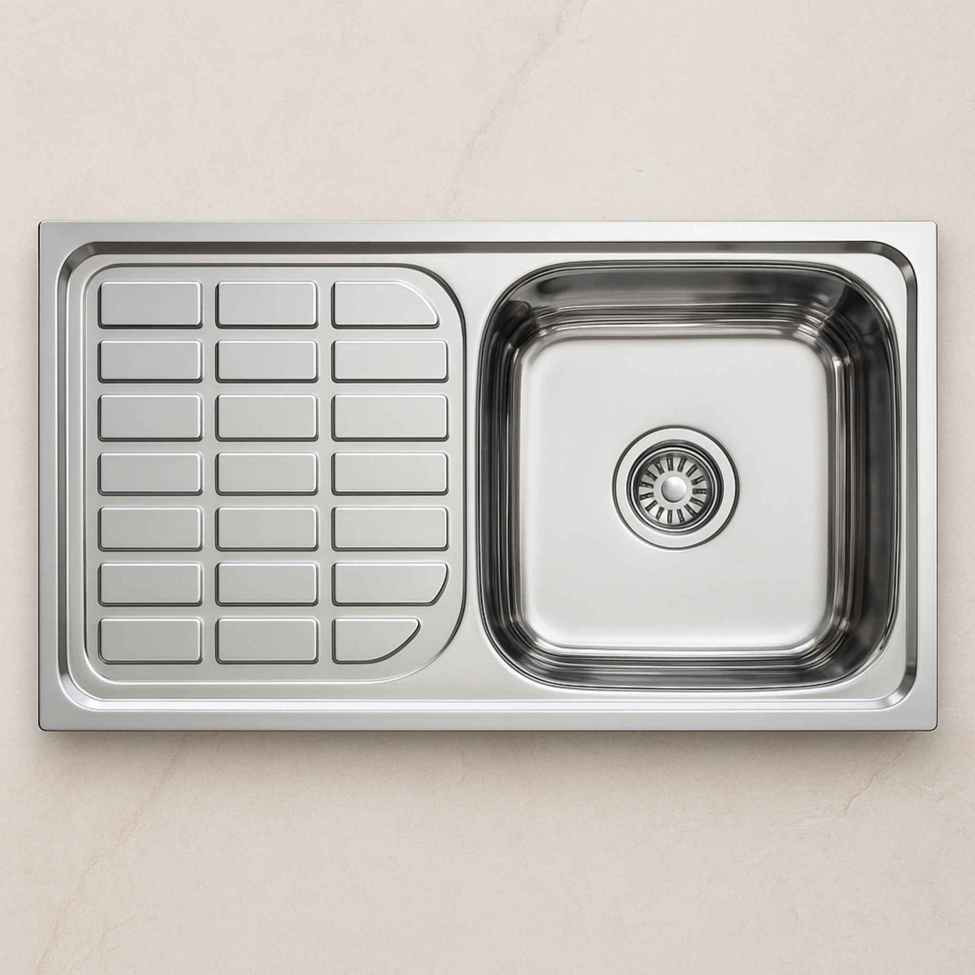 Top view of stainless steel kitchen sink with drainboard