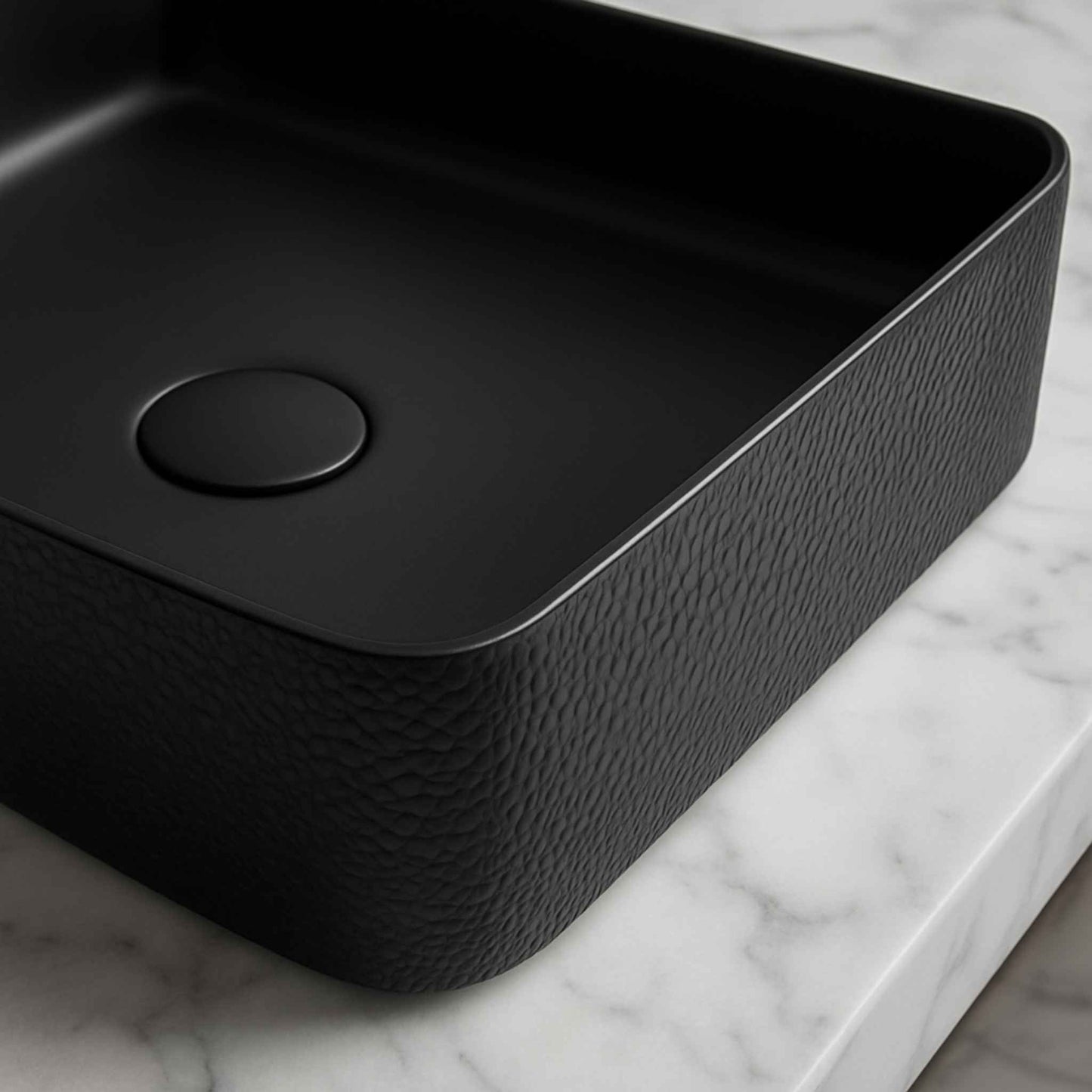 Black rectangular sink on a marble countertop