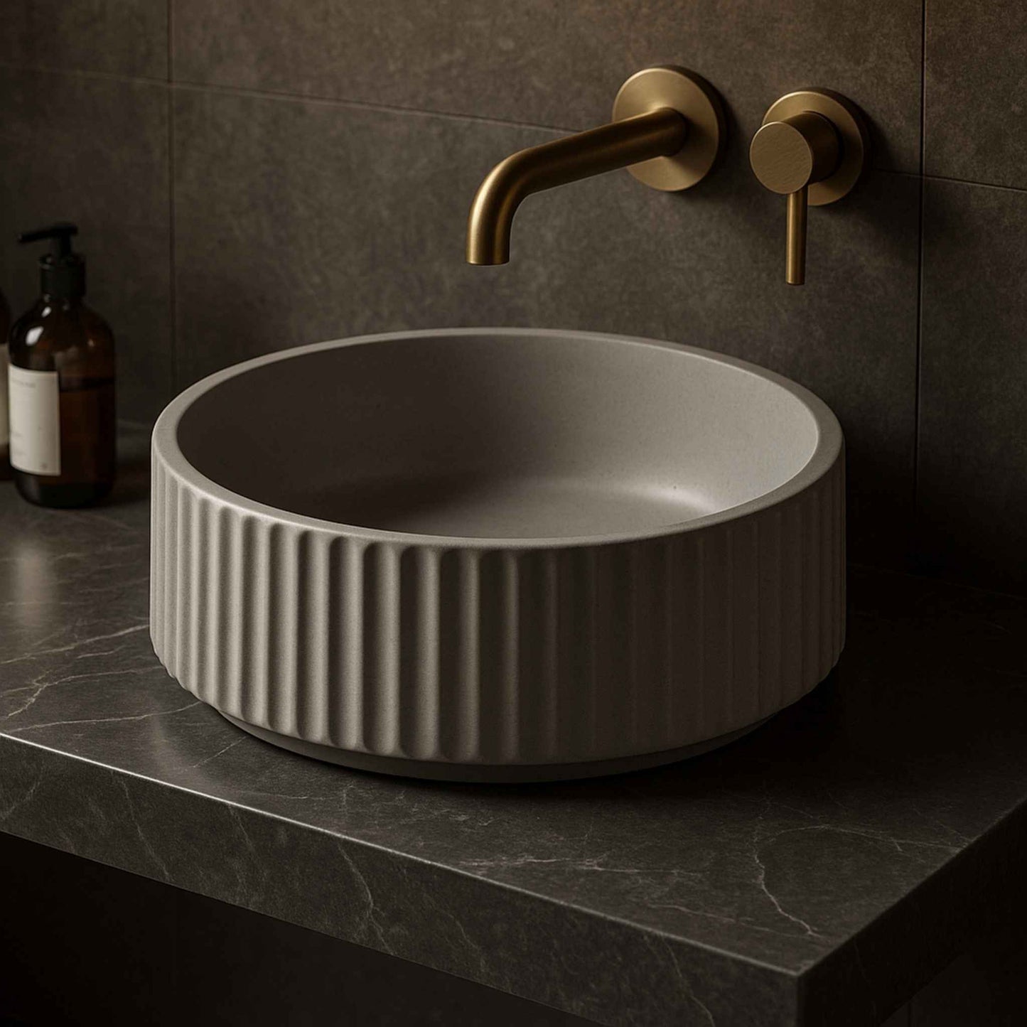 Front view of a fluted round concrete wash basin in a luxurious bathroom with wall-mounted faucet