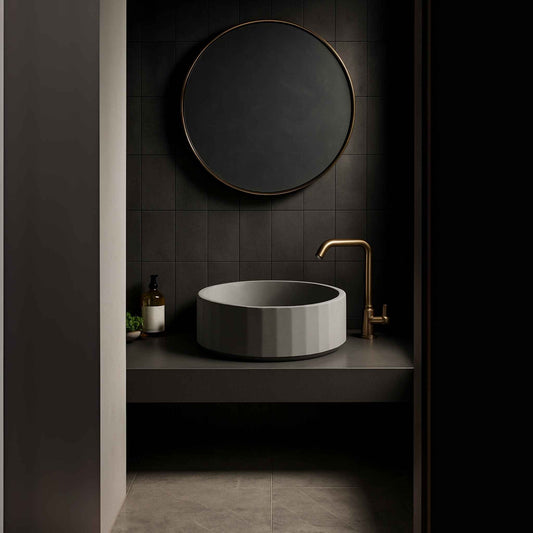 Side angle view of a grey fluted round concrete basin in a designer vanity setup