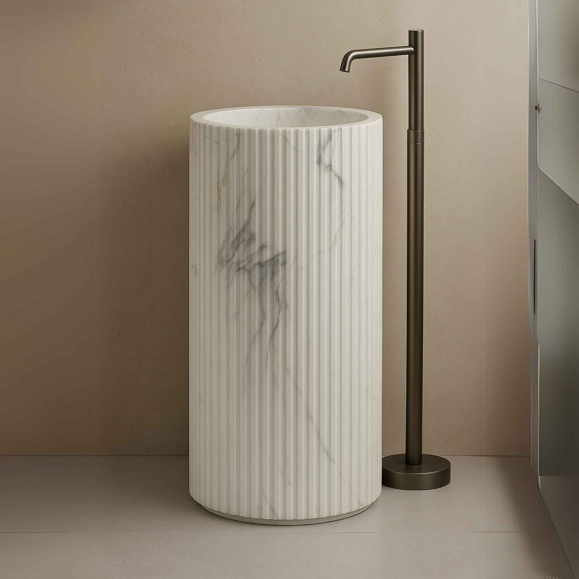 Side view of cylindrical fluted washbasin with marble veining against tiled background