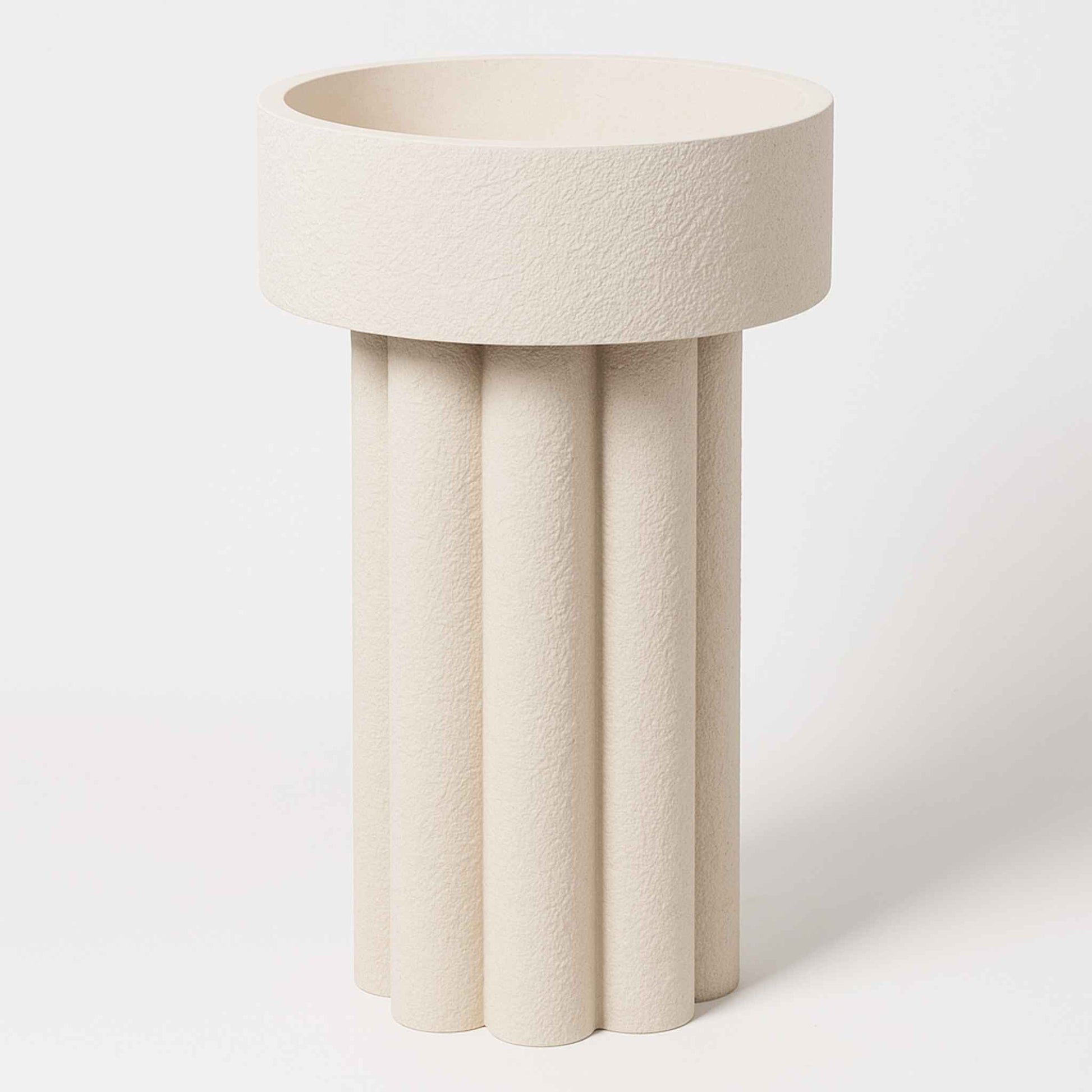 Front view of elegant textured stone pedestal washbasin – 825mm tall