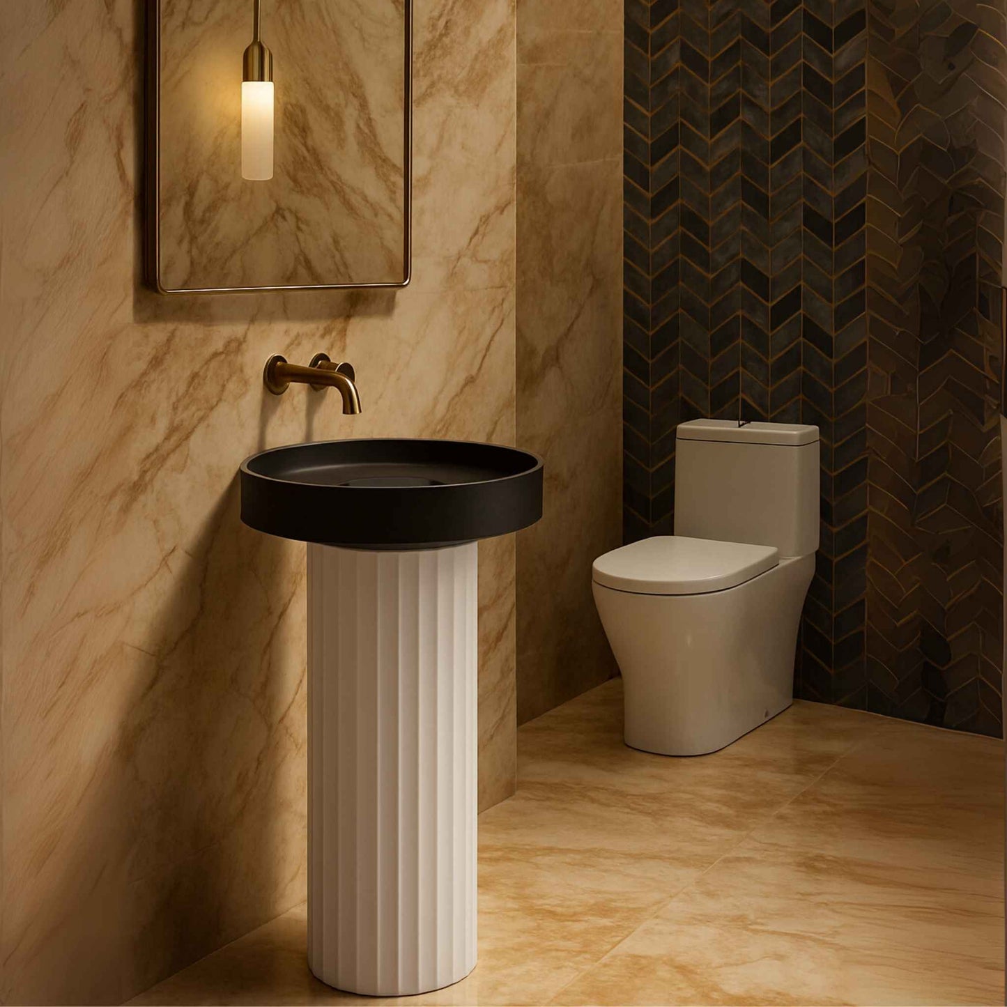  Luxurious bathroom view featuring round pedestal sink with black basin, white fluted base, gold mirror, and western toilet set against marble and chevron tiled walls.