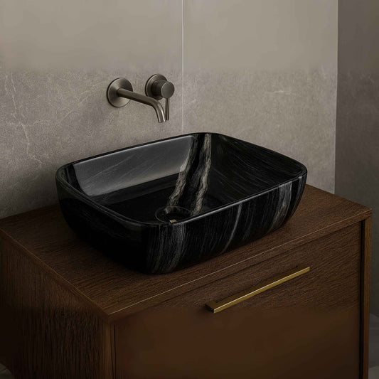 Front view of glossy black ceramic rectangular wash basin on a luxury vanity