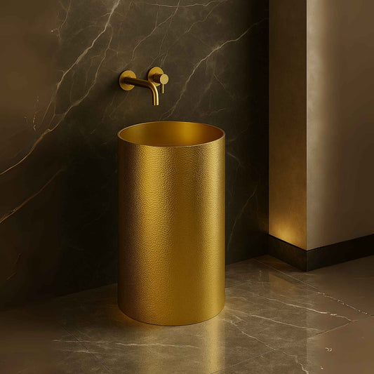 Gold pedestal wash basin front angle view in a luxurious bathroom setting