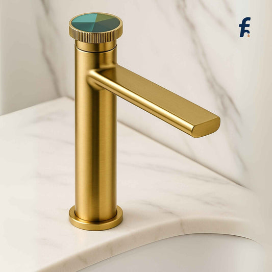 Gold faucet with a colorful handle on a white background